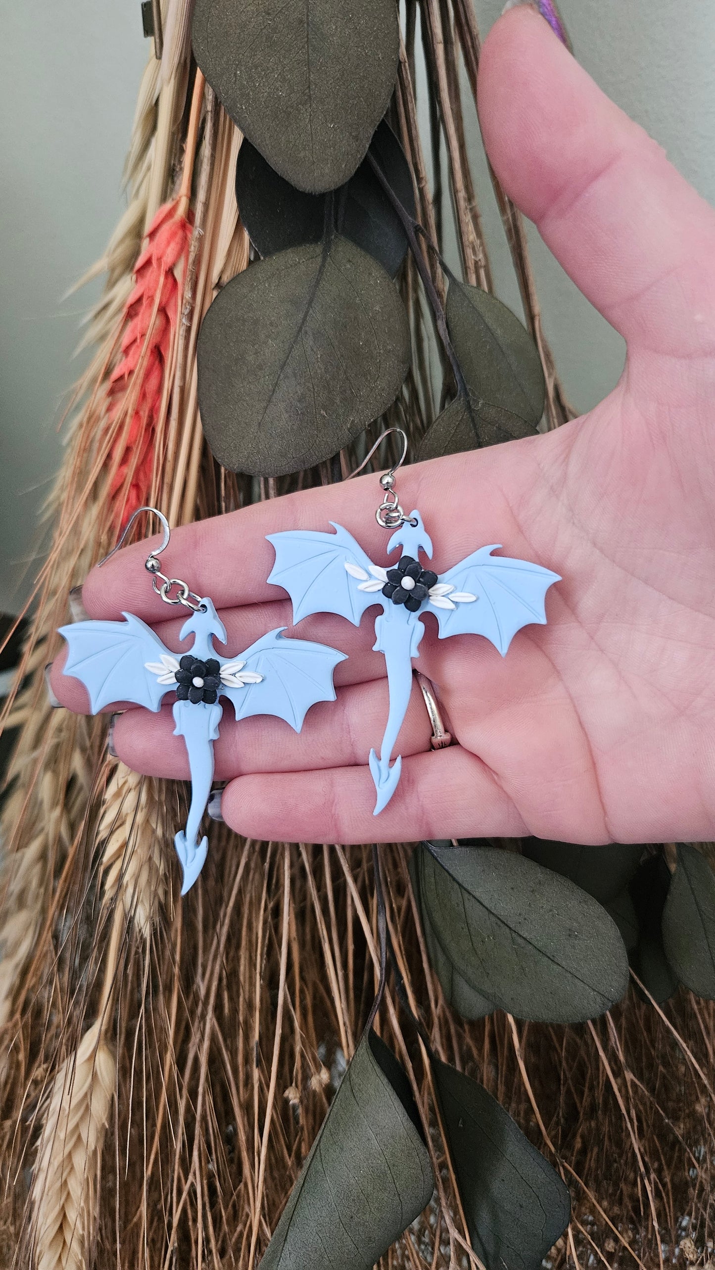 Dragon earrings with black flower