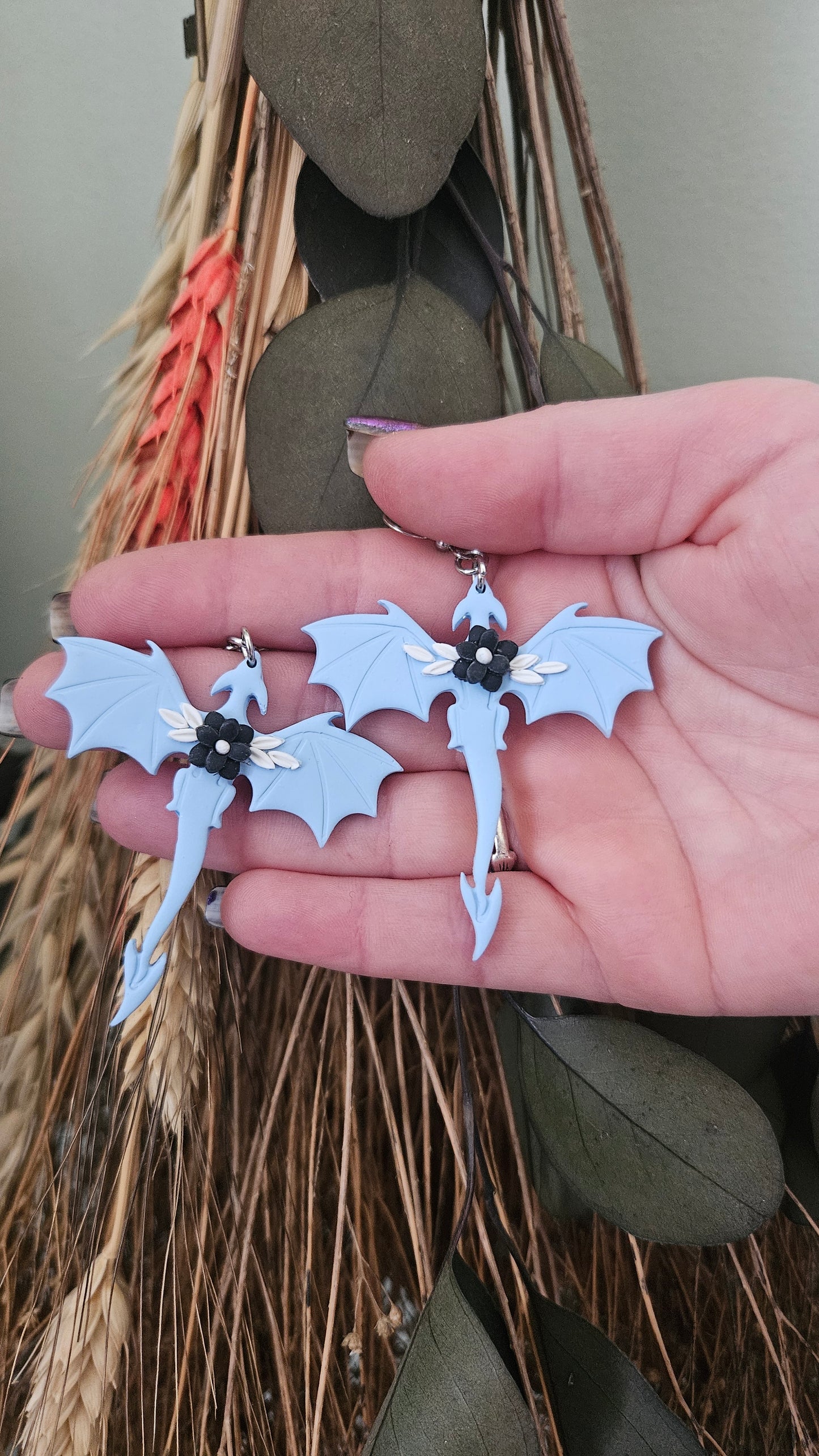 Dragon earrings with black flower